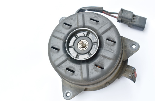 broken electric fan motor for car air conditioner system on white background