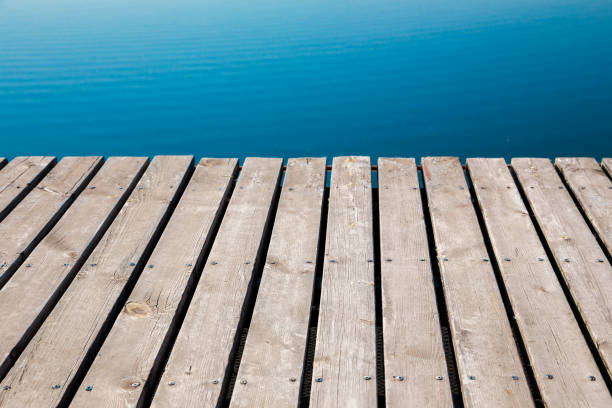 istock Wooden platform over the sea background 1147042934