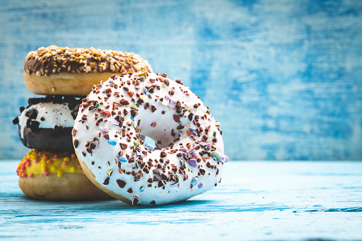 Various donuts on blue background