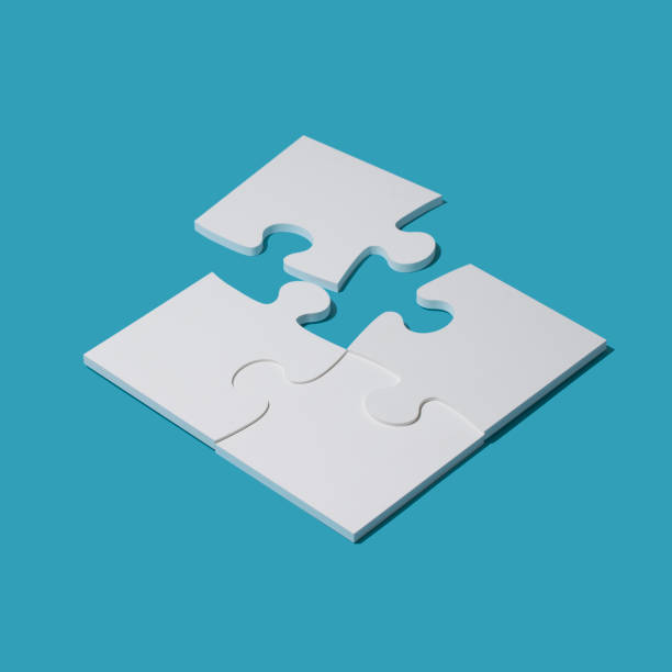 istock Completing a puzzle with the last piece 1147052161