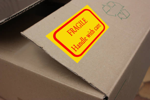 istock Cardboard box for moving  Label Fragile Handle with care 1147053140