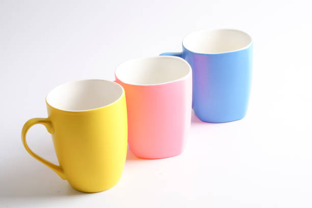 istock Colorful Coffee Cups Against White Background 1147055190