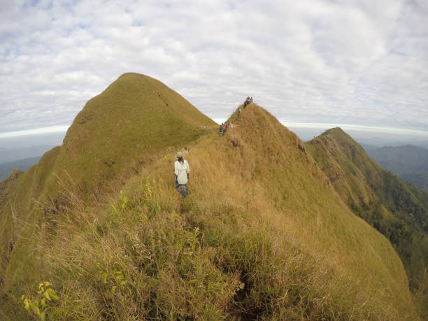 istock People of hikers walking on a mountain. 1147056546