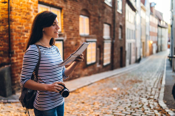 istock Woman exploring Lubeck old town 1147059340