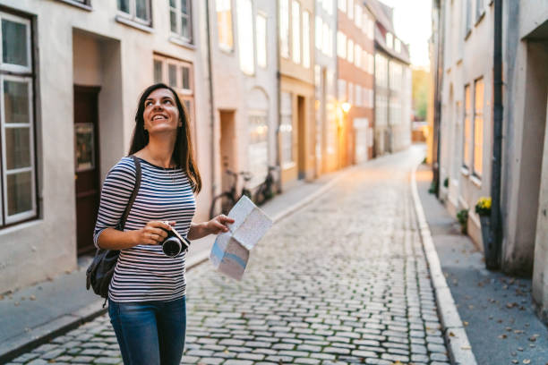 istock Woman exploring Lubeck old town 1147060315