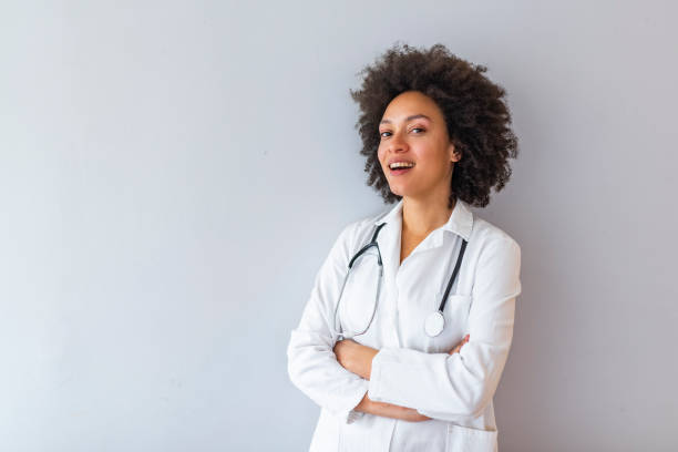 istock Woman hospital worker looking at camera and smiling 1147063557
