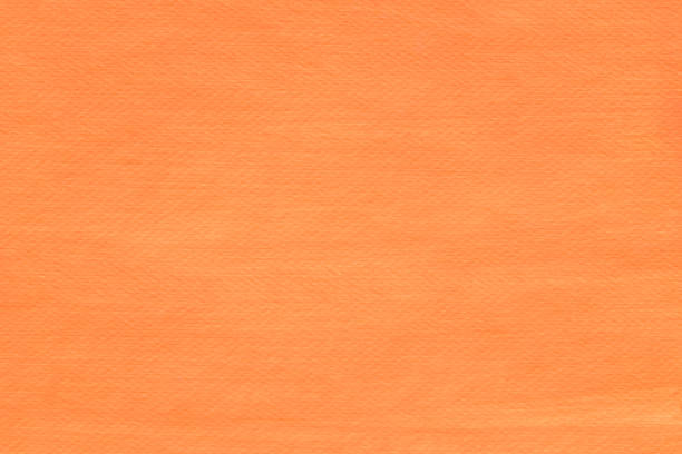 istock orange painted on paper background texture 1147069046