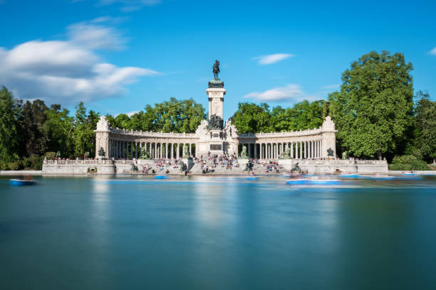Great pond at the Parque del Retiro in Madrid Great pond and monument to Alfonso XII at the Retiro Park (Parque del Buen Retiro) in Madrid in early Spring. Long exposure. madrid stock pictures, royalty-free photos & images