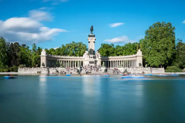 Great pond and monument to Alfonso XII at the Retiro Park (Parque del Buen Retiro) in Madrid in early Spring. Long exposure.