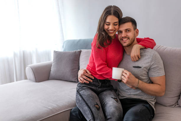 istock Cheerful beautiful young couple drinking coffee. 1147070516