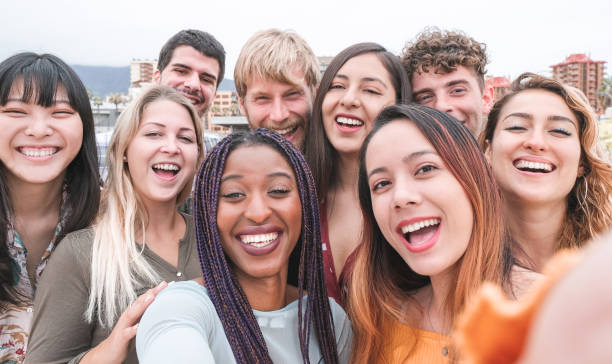 happy friends from diverse cultures and races taking photo making funny faces - youth, millennial generation and friendship concept with young people having fun together - day asian ethnicity asian culture asian and indian ethnicities imagens e fotografias de stock