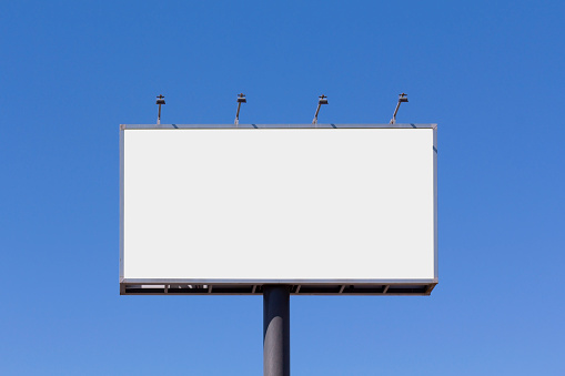 Blank billboard mock up for advertising, against blue sky