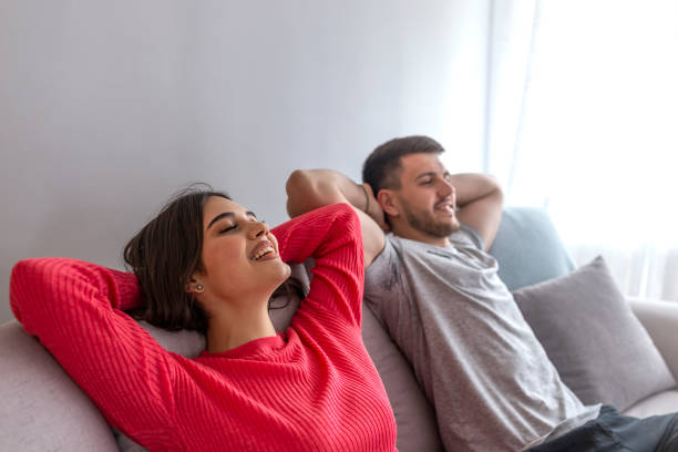 istock Couple at home relaxing in sofa. 1147071545