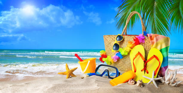 istock Tropical beach with sunbathing accessories, summer holiday background 1147074810