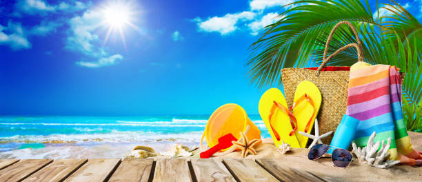 istock Tropical beach with sunbathing accessories, summer holiday background 1147074816