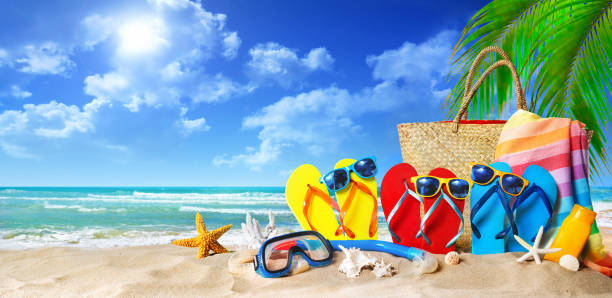 istock Tropical beach with sunbathing accessories, summer holiday background 1147074823