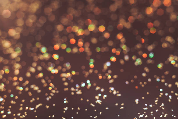 istock Beautiful gold bokeh on a brown background. 1147074900