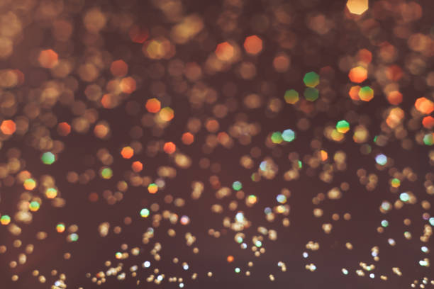 istock Beautiful gold bokeh on a brown background. 1147074914