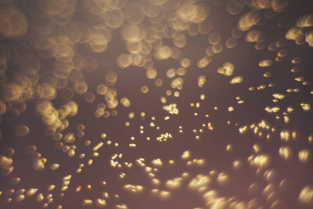 istock Beautiful gold bokeh on a brown background. 1147075129