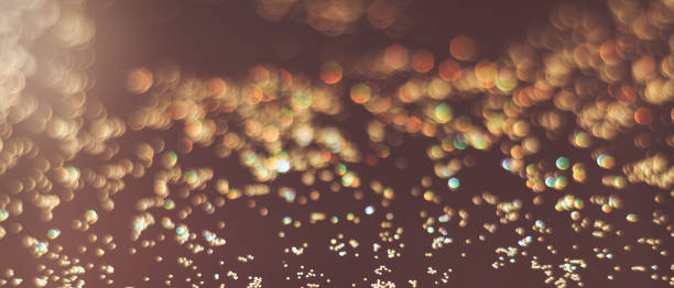 istock Beautiful gold bokeh on a brown background. 1147075911