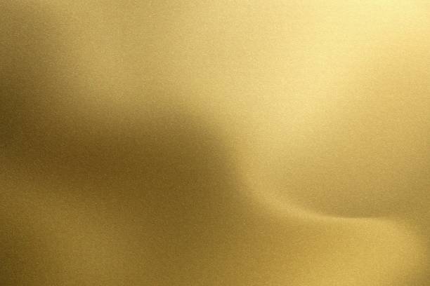 istock Shiny brushed golden wave metal, abstract texture background 1147077031
