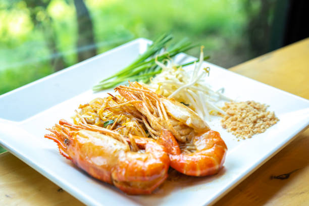 Thai fried noodles or Pad Thai with shrimp and vegetables.