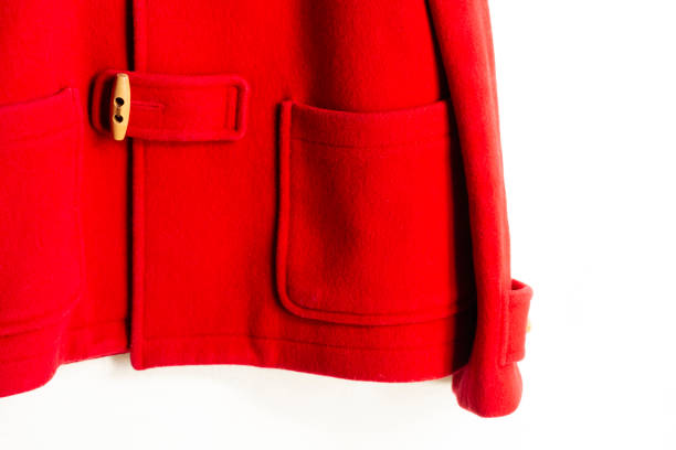 istock red wool coat hanging on clothes hanger on white background 1147077412