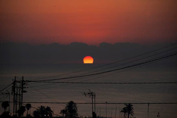 Orange sky during sunrise over sea in Alicante