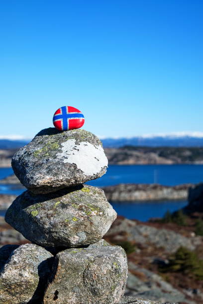 istock Norwegian flag on the top stone. 1147078743