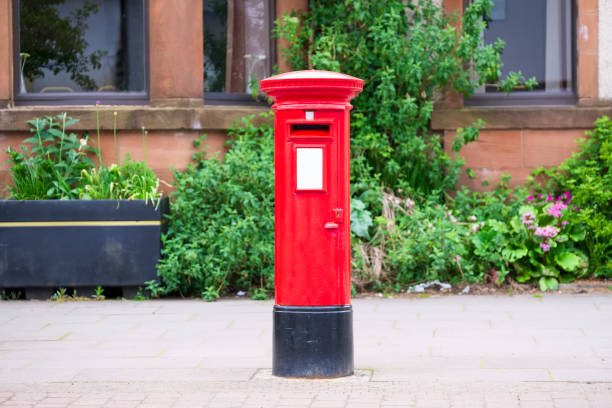 istock Traditional old red post box for mail and delivery of letters 1147081783