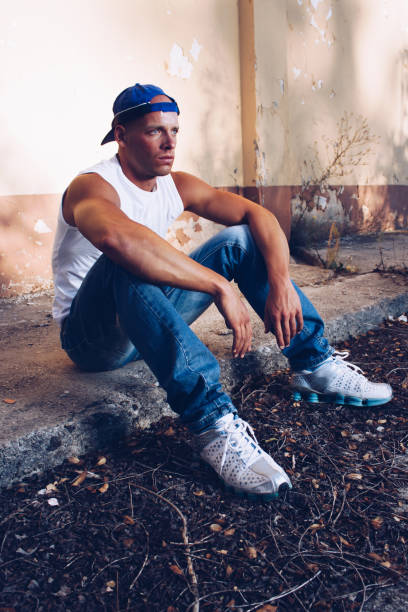 istock Young Man In Urban Setting posing in abandoned place. 1147087139