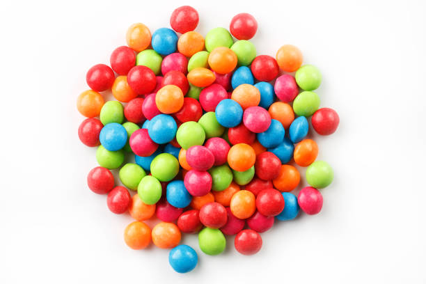 istock A rainbow of colors from multicolored candies close-up, multi-colored glaze dragee on a white background isolated 1147087316