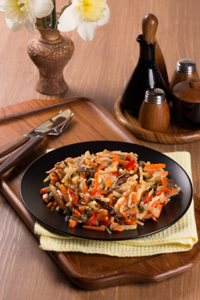 istock cut vegetables in a black plate on a wooden table 1147087332