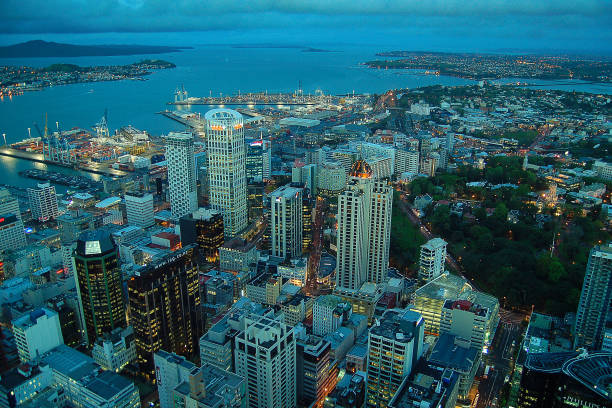 Auckland New Zealand from above: overview of the City of Sails with its famous harbor from Sky Tower during the blue hour Auckland, New Zealand, Sky Tower, North Island, Auckland Region, southern hemisphere Waitemata Harbor stock pictures, royalty-free photos & images