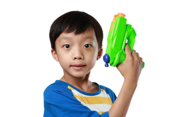 istock Children playing with toy guns 1147088465