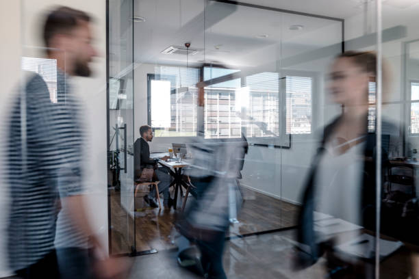 istock Business colleagues walking in the office 1147089335