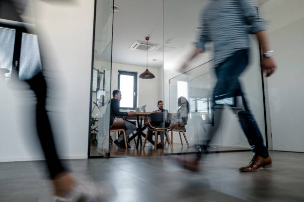 istock Business colleagues walking in the office 1147089337