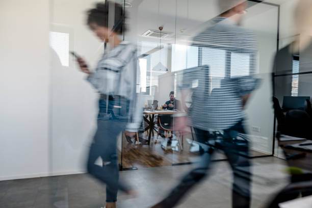 istock Business colleagues walking in the office 1147089342