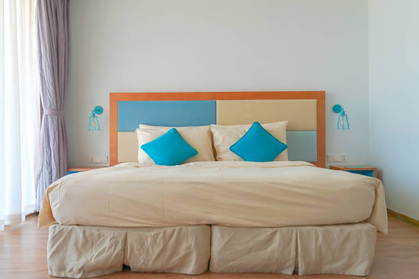 istock Light blue and wood bedroom design 1147091370