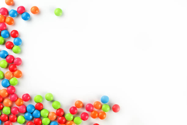 istock A rainbow of color from multicolored candies close-up, multi-colored glaze dragee on a white background 1147091802