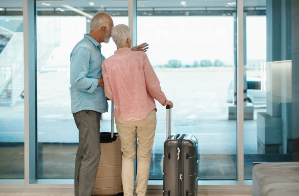 istock Mature couple waiting for the flight. 1147092609