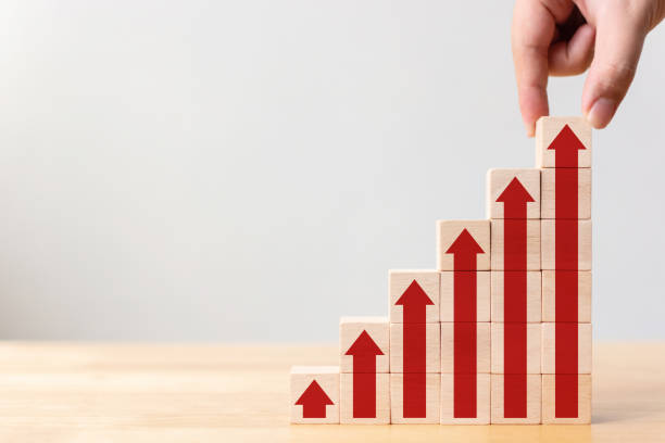 istock Ladder career path for business growth success process concept.Hand arranging wood block stacking as step stair with arrow up 1147096675