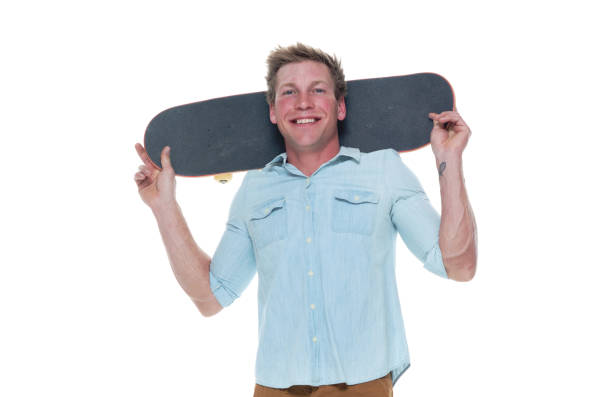 istock Casual well dressed man holding a skateboard 1147098206