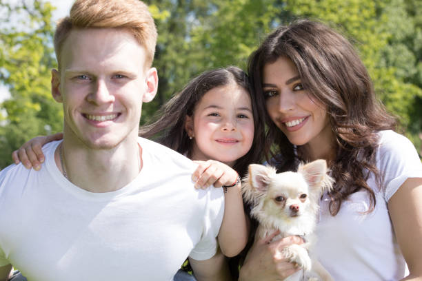 istock Happy family with dog 1147099206