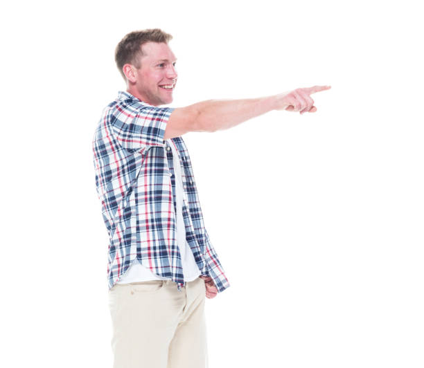 istock Handsome man in shirt and shorts pointing forward 1147099677