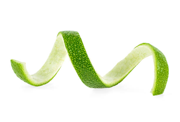 istock Peel of fresh lime over white background, closeup. 1147102458