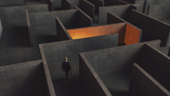 Young businessman lost in maze. This is entirely 3D generated image.