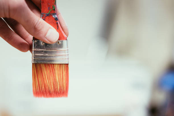 istock Painting artwork: paint brushes on painting background 1147104780