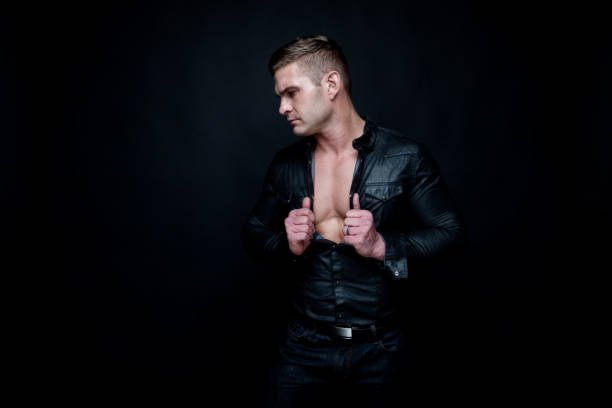istock Attractive muscular man wearing black 1147104961