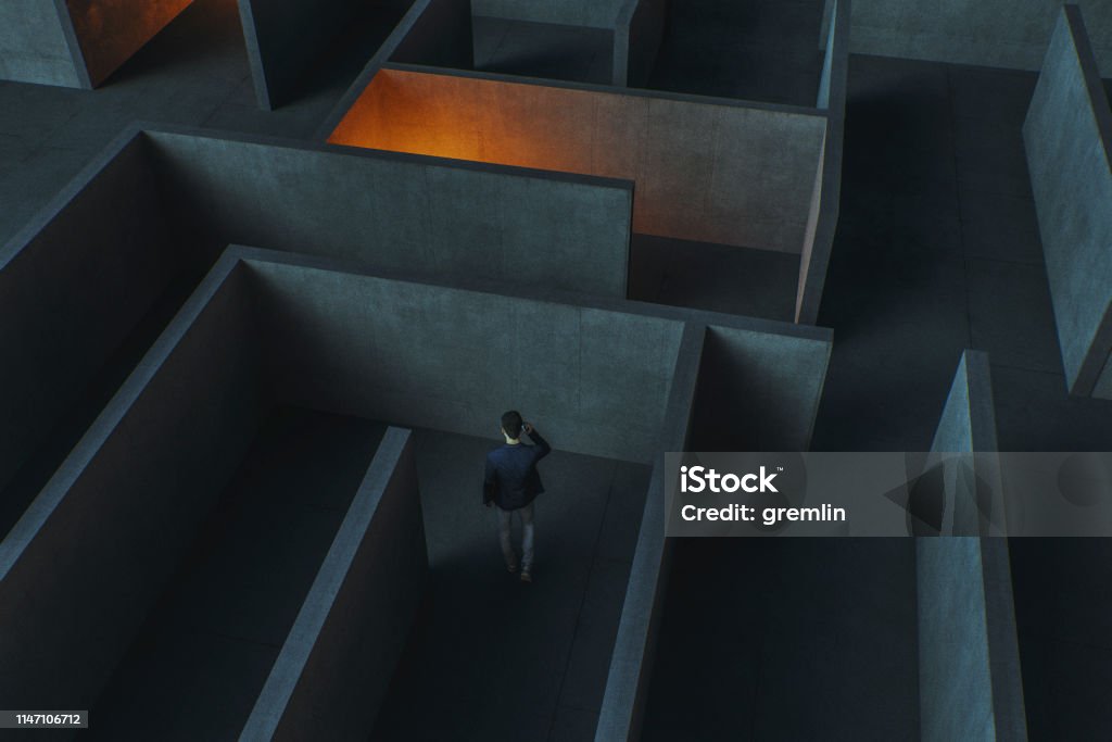 Young businessman lost in maze Young businessman lost in maze. This is entirely 3D generated image. Ignorance Stock Photo